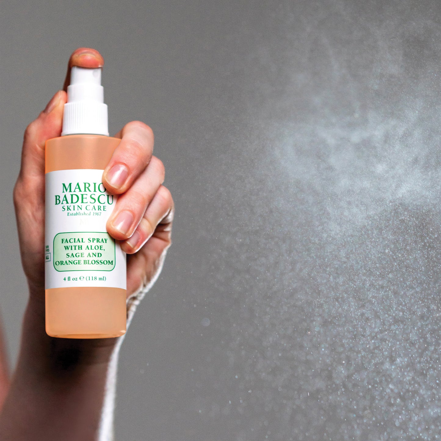 Facial Spray With Aloe, Sage, Orange Blossom being misted