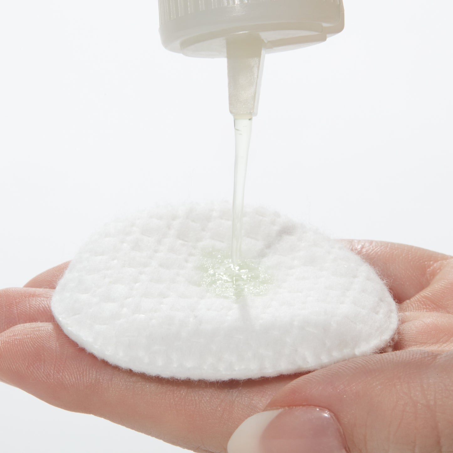 Demonstration showing how to use Cucumber Cleansing Lotion on a cotton pad