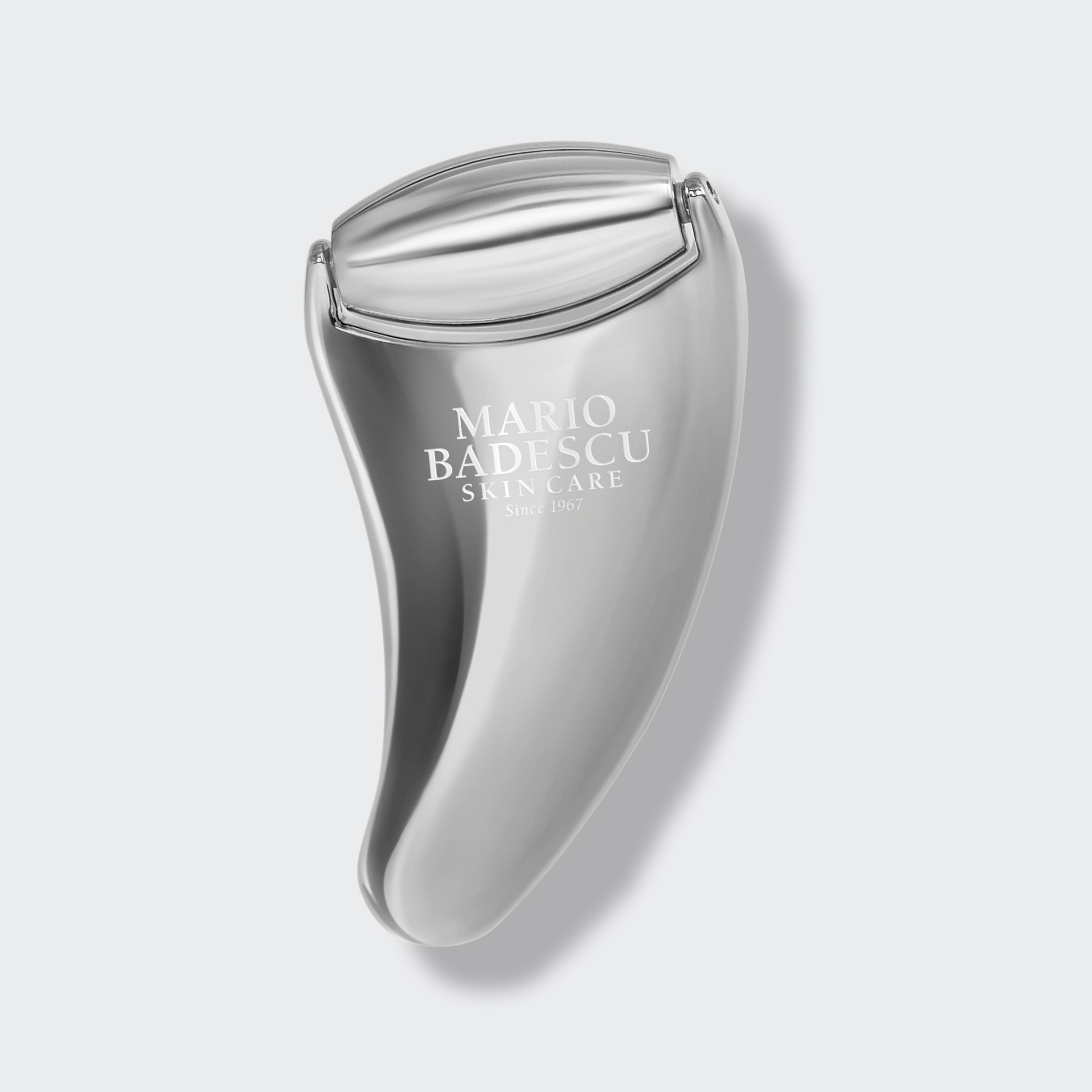 Mario Badescu skincare tool on a light gray background