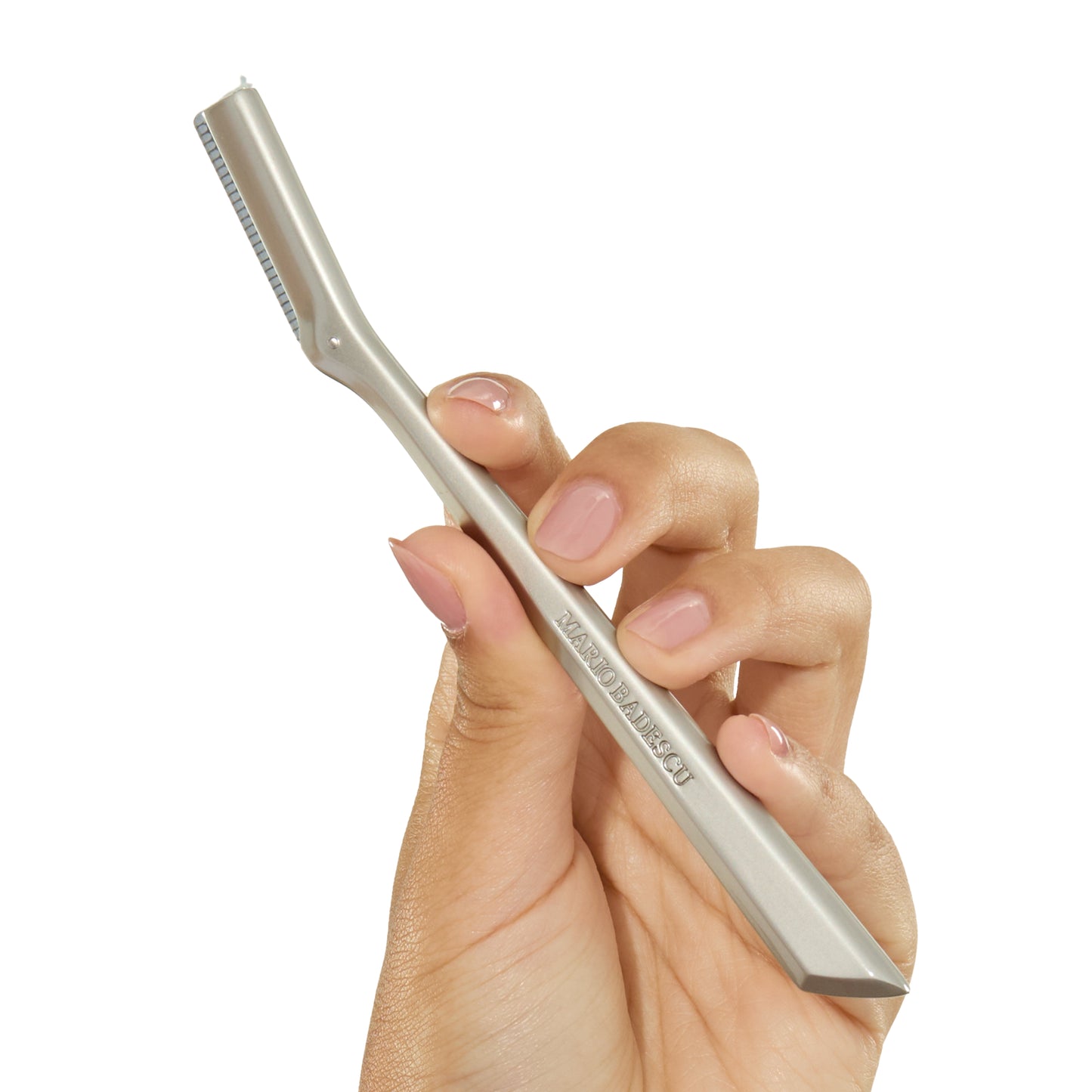 Hand holding a Metal Dermaplaner with brand name on a white background on a white background