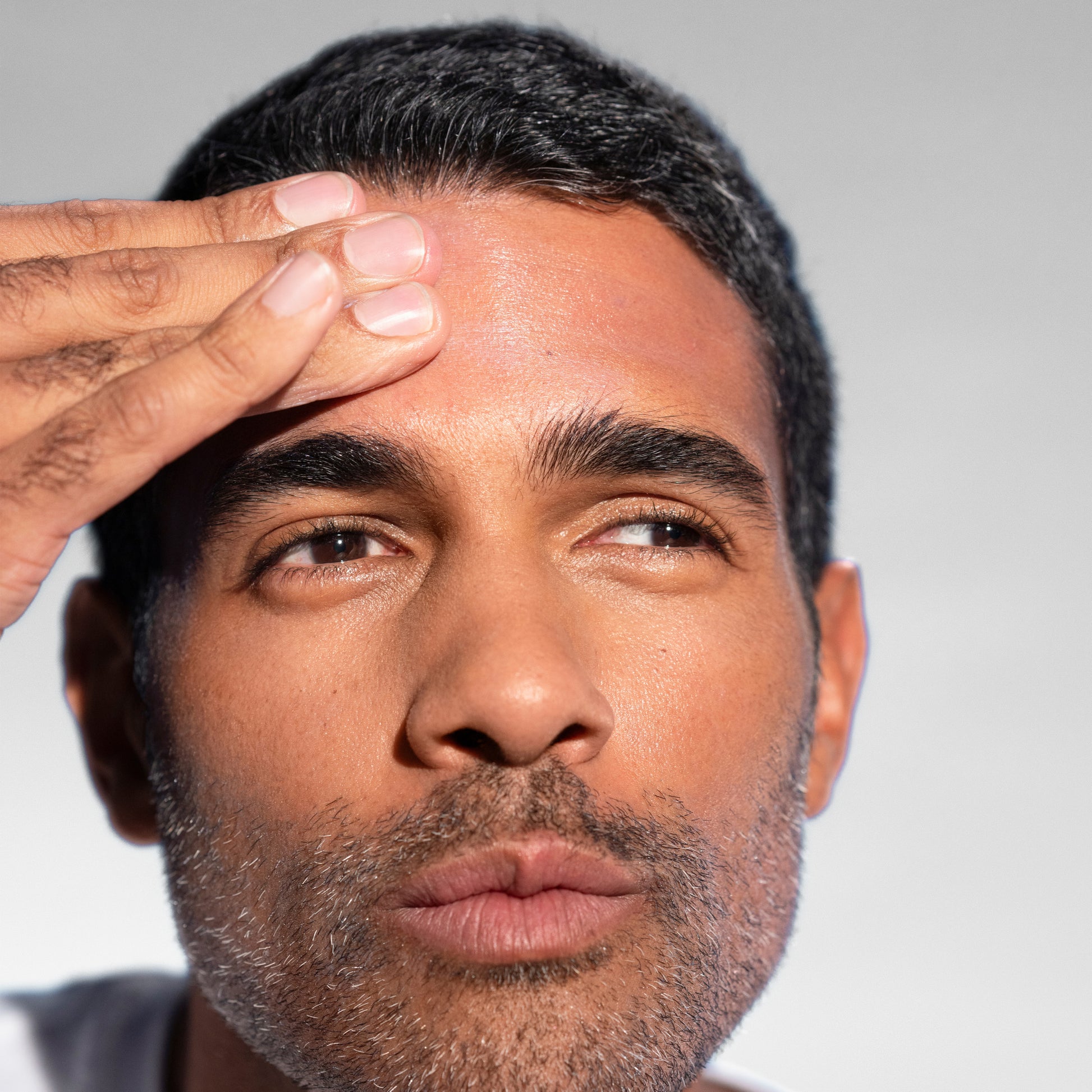 Man with glowing skin, showing the effects of Mineral Sunscreen SPF 30