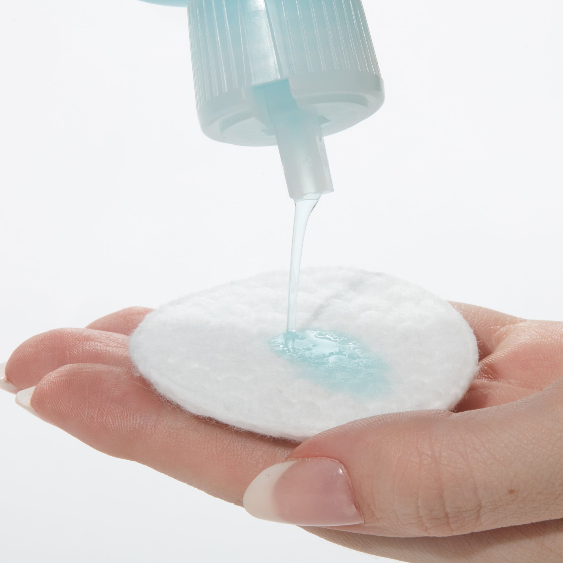 Demonstration showing how to use Glycolic Acid Toner on a cotton pad